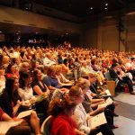 audience seated at synetic