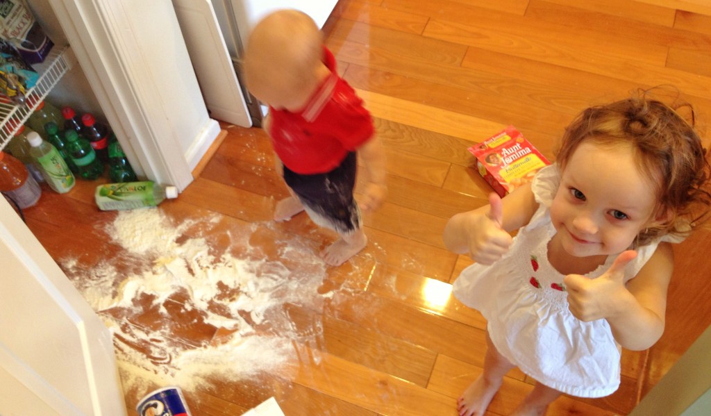 Ava thumbs up for Charlie spilling flour