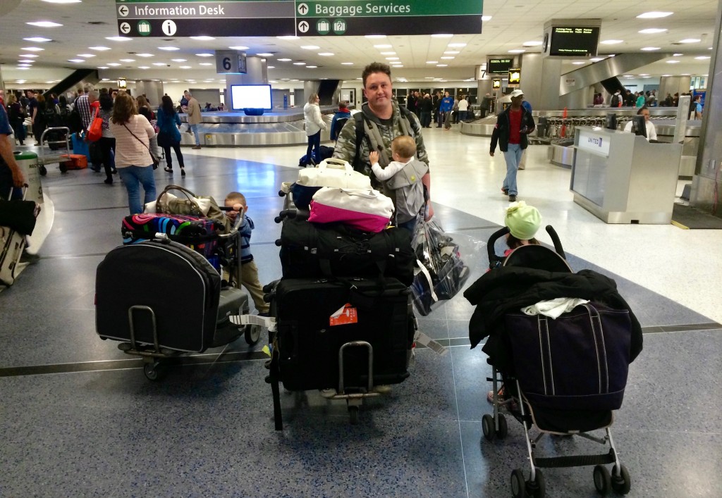 Adrian in Texas airport with luggage