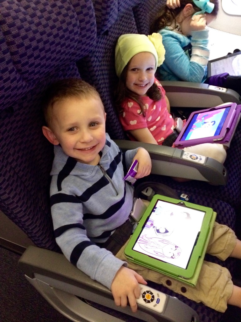 Kids with Ipads on plane