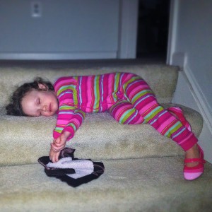 Ava sleeping on the stairs