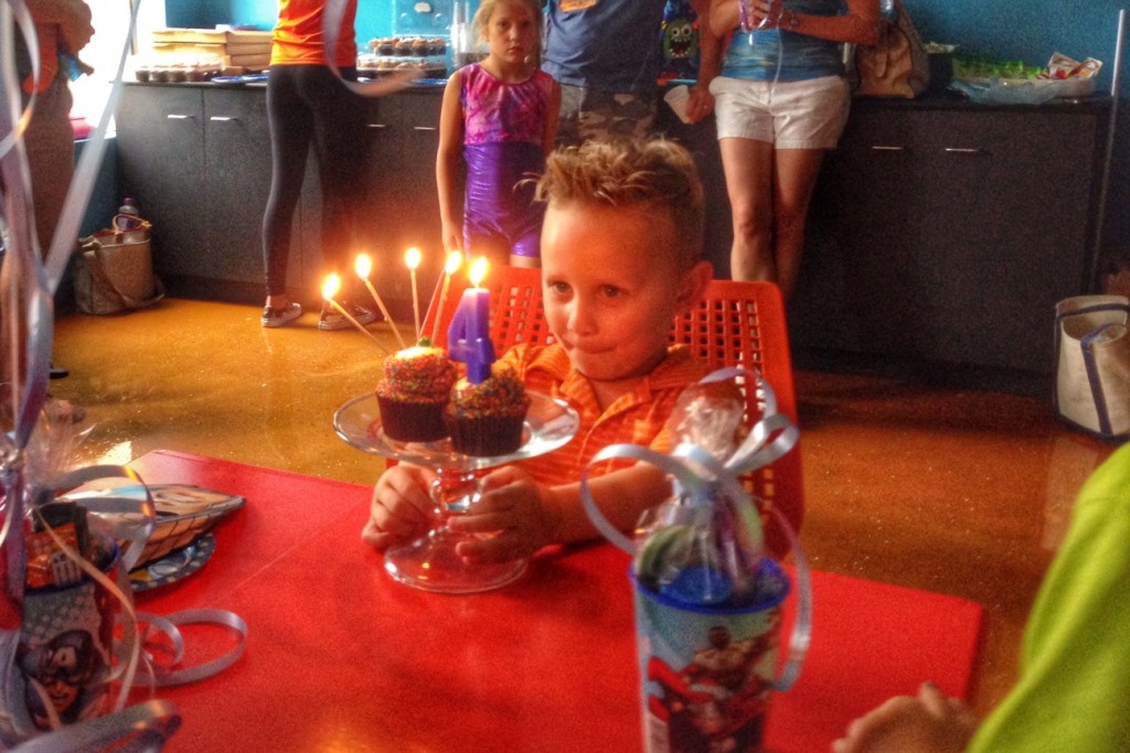 Charlie blows out candles