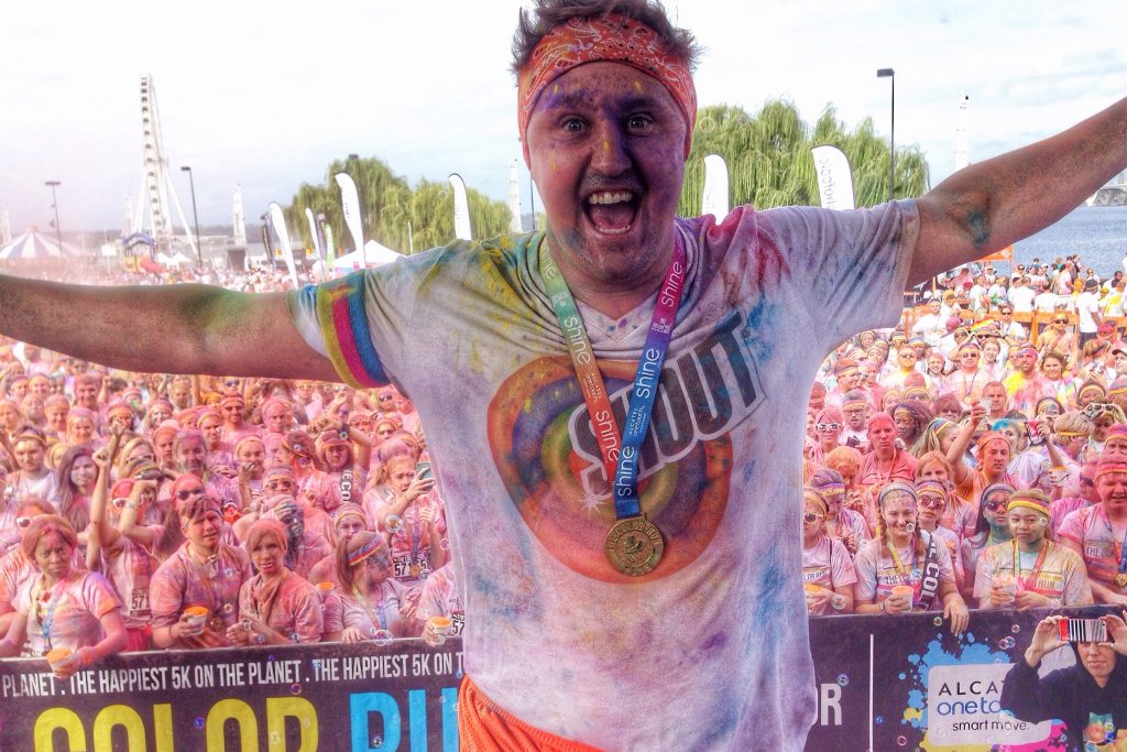 Adrian on stage at Color Run