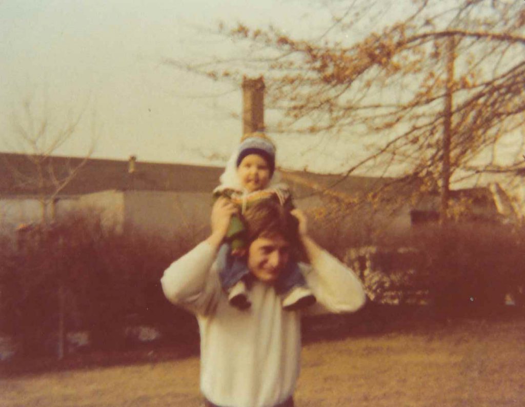Dad holding me as a kid